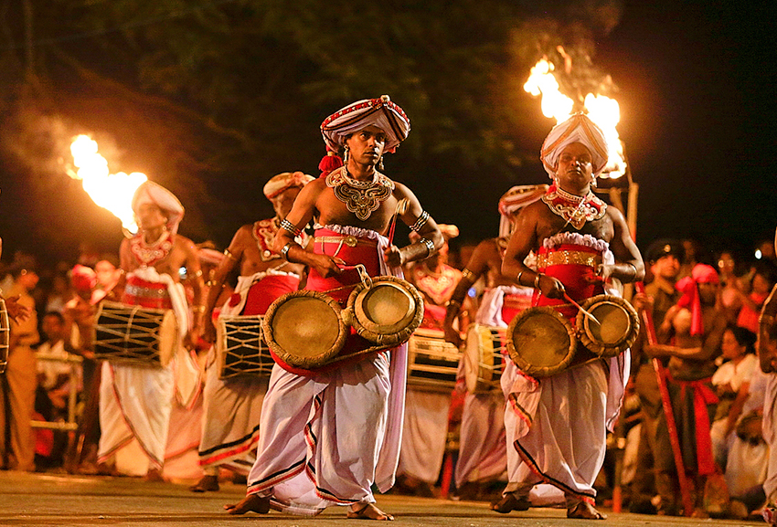 Traditional Sri Lankan drummers in a torchlit procession